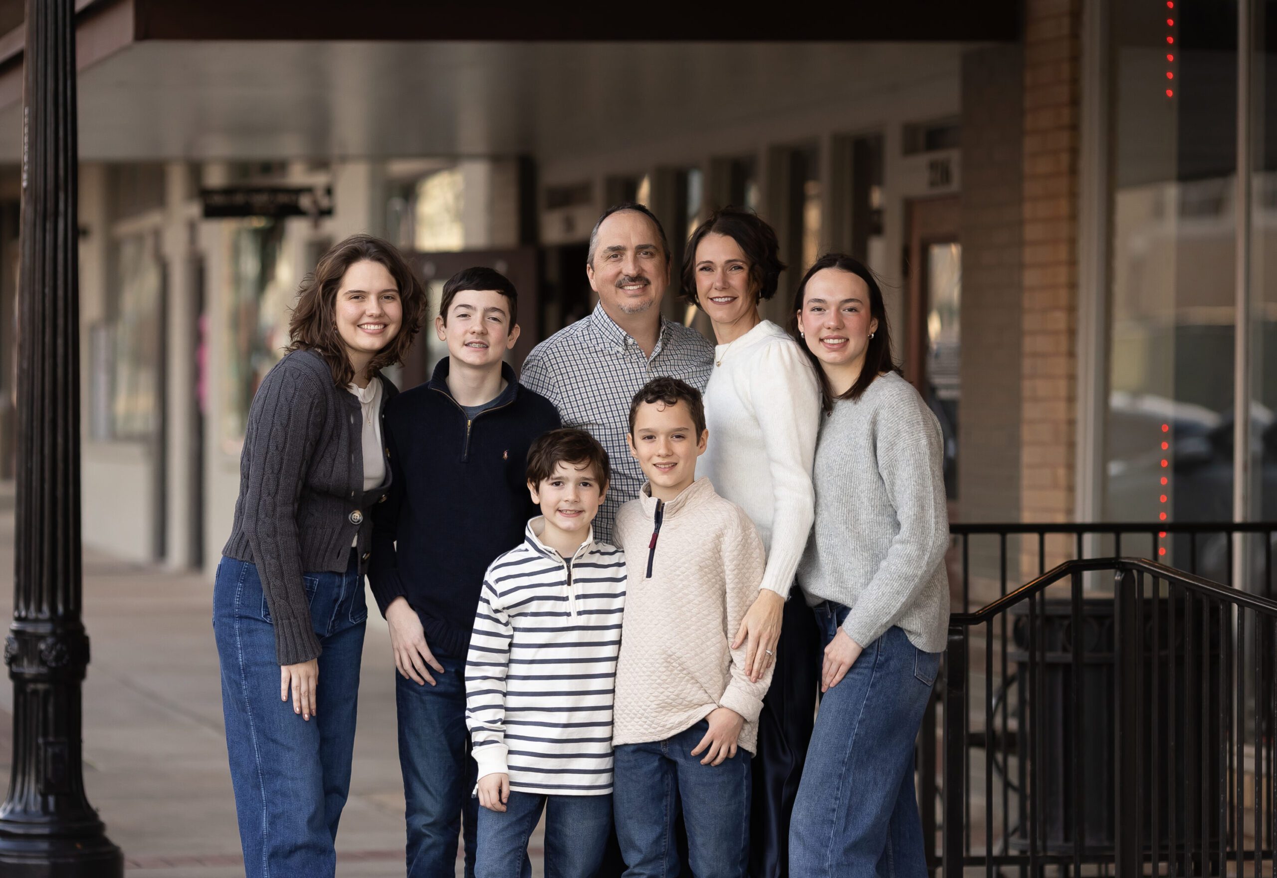 Neal family of seven during downtown Bryan family photography session with Lauren Melissari & Sarah Burns Photography.
